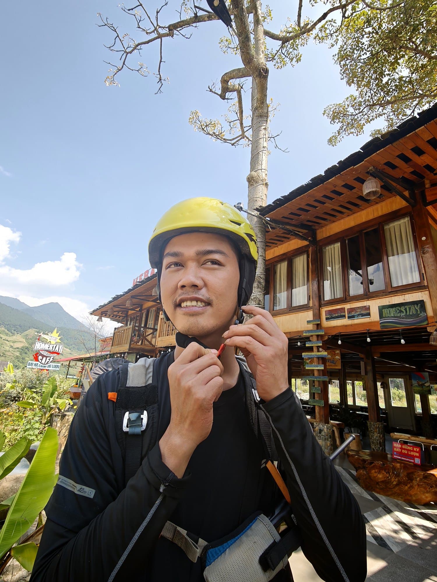 Fasten the chin strap before clipping in; the helmet leaves the ears free to hear the wind and the radio.